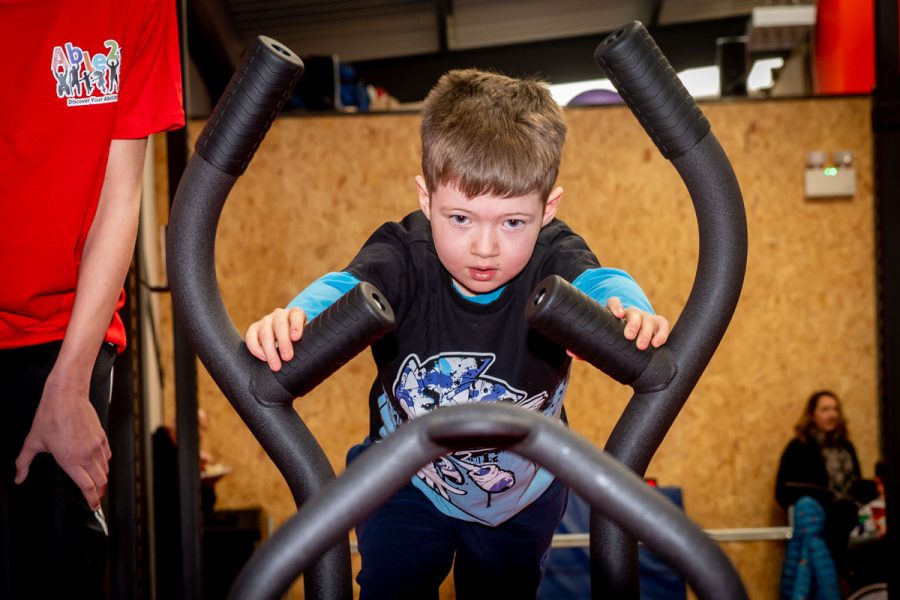 Young boy using exercise facilities at Able 2 Be