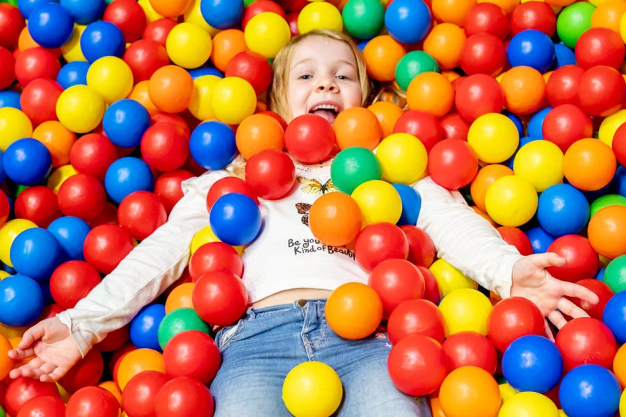 Girl in leisure club ball pit