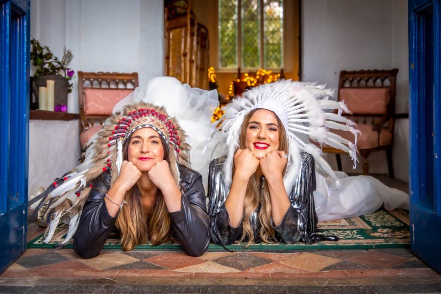 Bridal models in red-indian headwear at the Flint Room