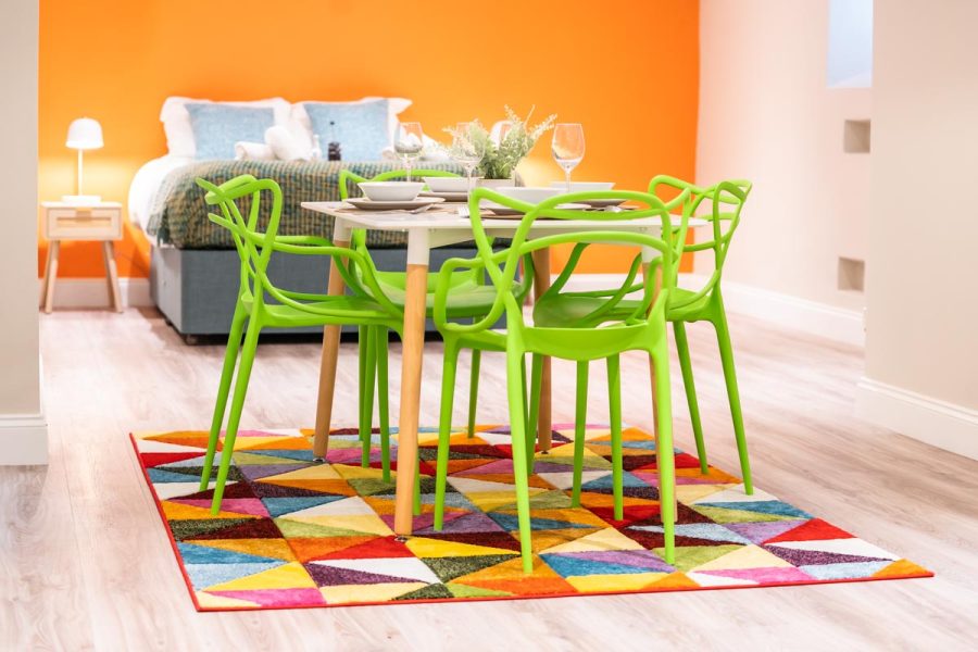 Modern dining table in colourful studio flat